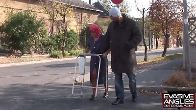 EVASIVE ANGLES This babushka, stockings and glasses wearing grannie, is getting her expressed older melons deep-throated by her interracial caregiver